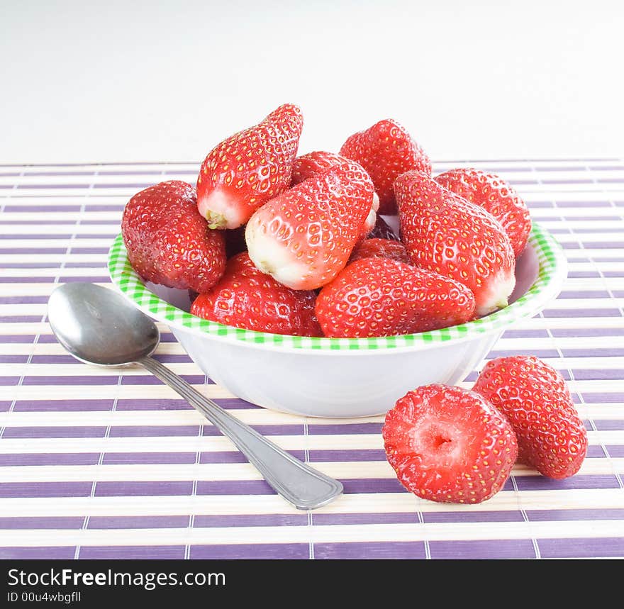 You have fresh strawberries in the bowl