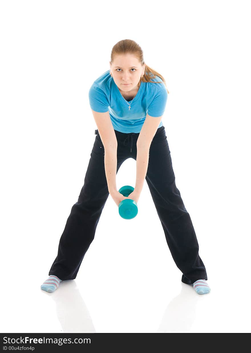 The beautiful young woman doing exercise isolated on a white background