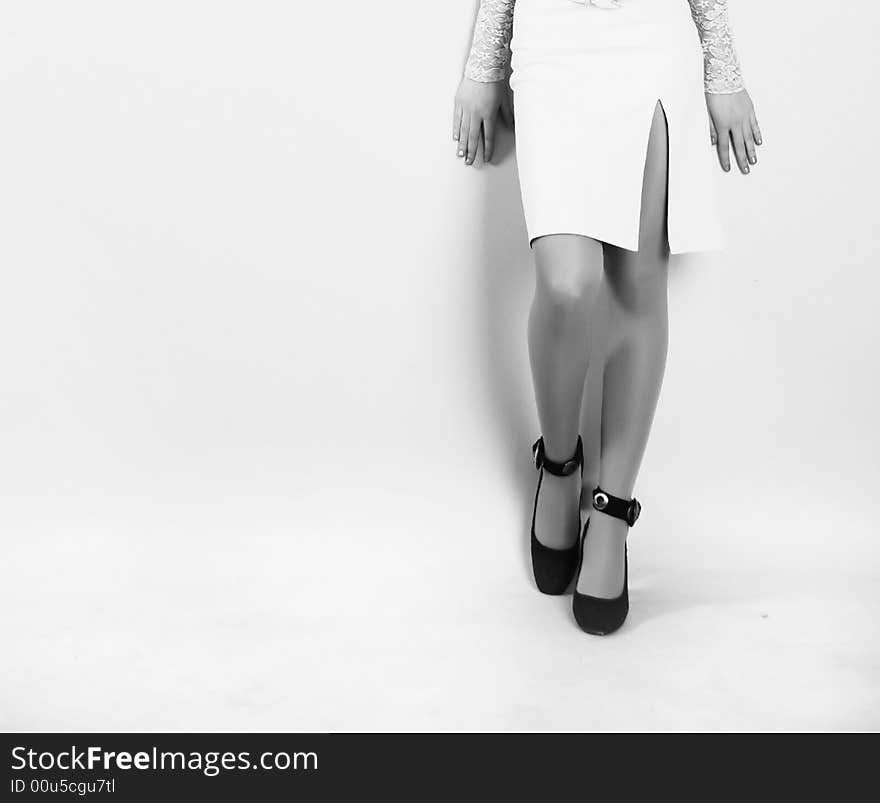 Beauty legs of youn woman at white background. Beauty legs of youn woman at white background