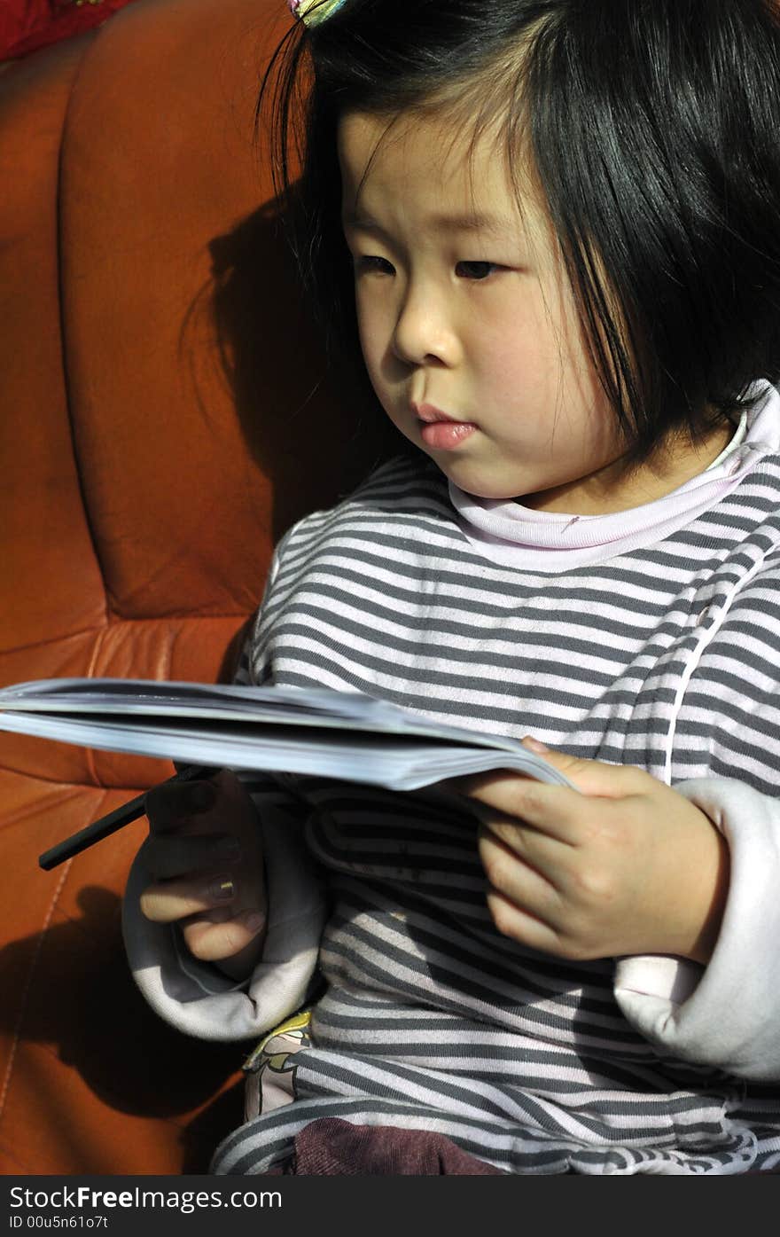 Chinese girl reading and thinking