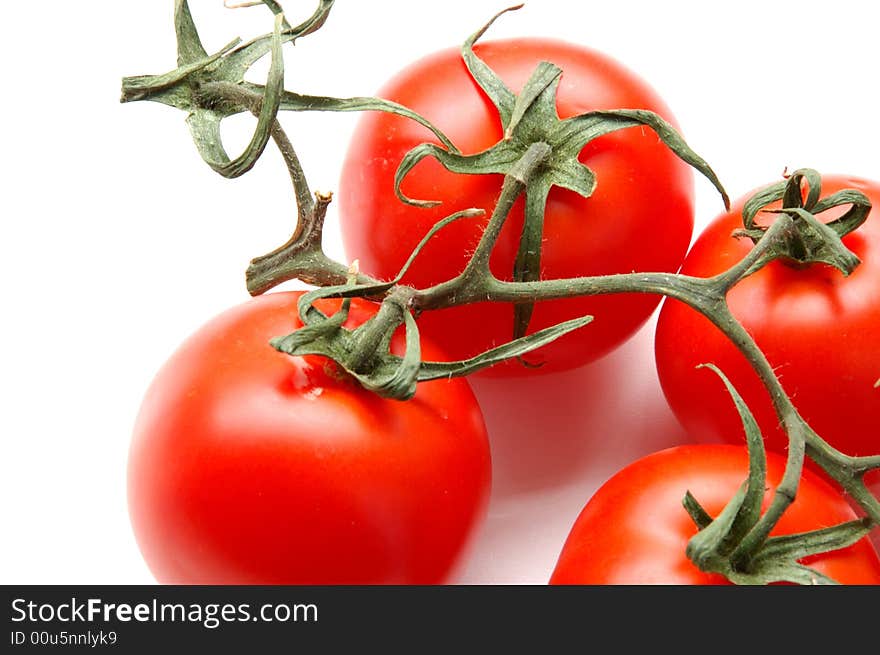 Red tomatos isolated on white