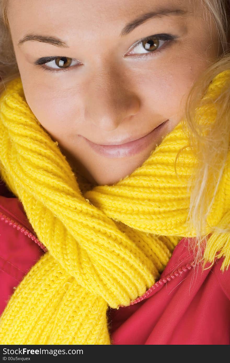 Beautiful female wearing red jacket and yellow scarf. Beautiful female wearing red jacket and yellow scarf