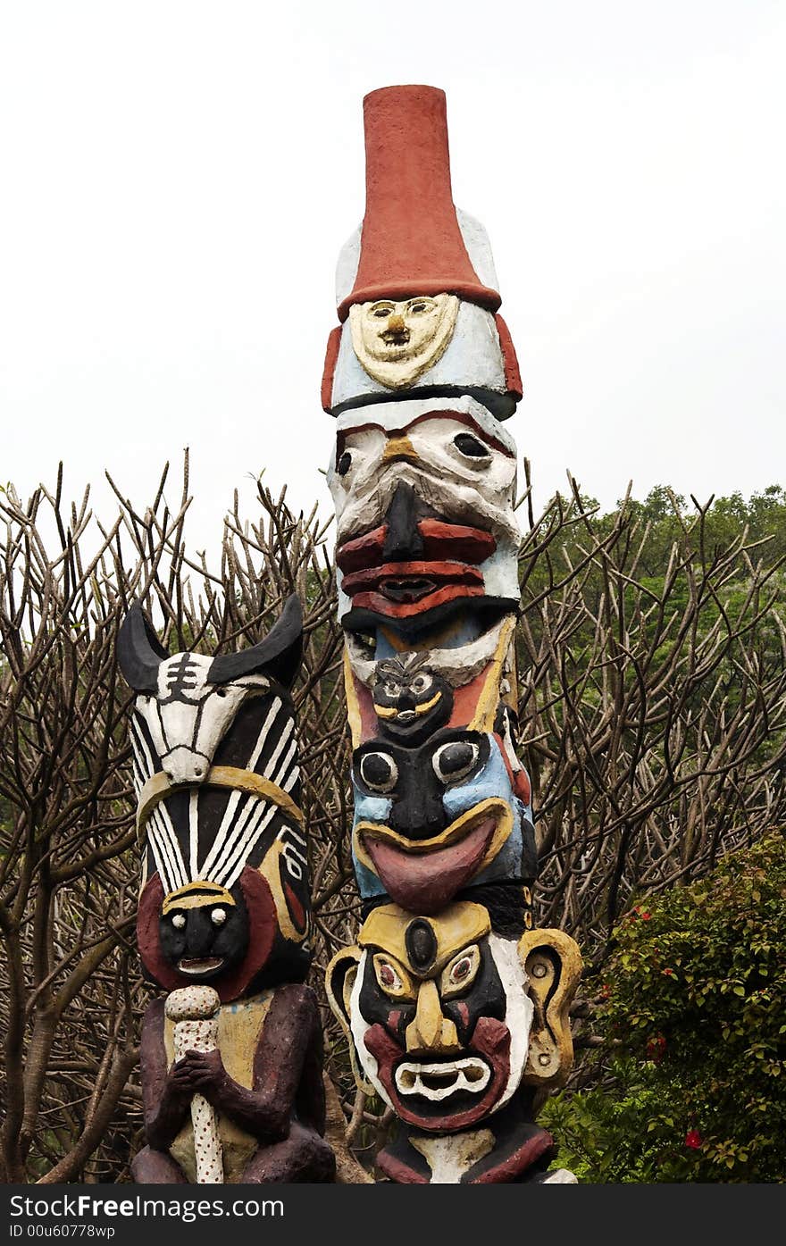 Totem pole ,serving among certain tribal or traditional peoples as the emblem of a clan or family and sometimes revered as its founder, ancestor, or guardian.