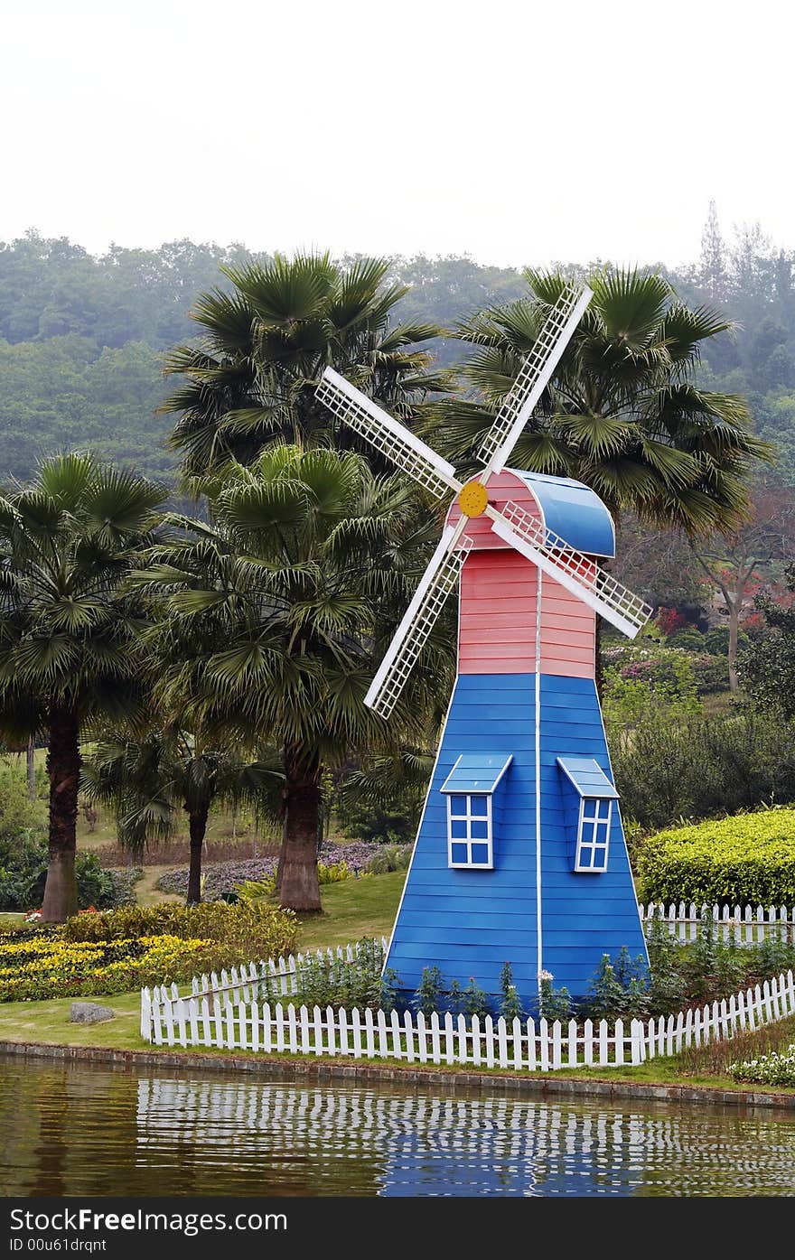 A machine that runs on the energy generated by a wheel of adjustable blades or slats rotated by the wind. A machine that runs on the energy generated by a wheel of adjustable blades or slats rotated by the wind.