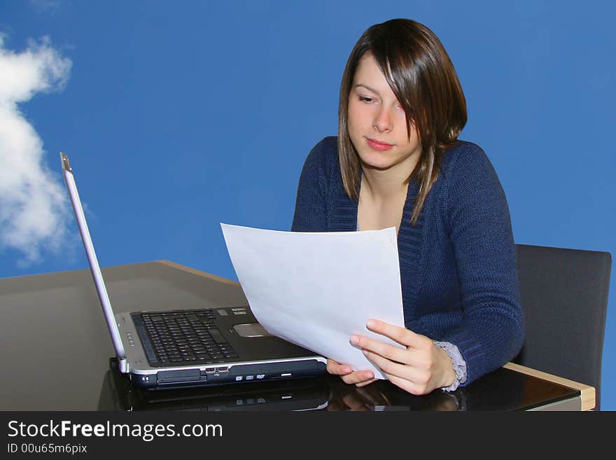 A young woman working at home with notebook