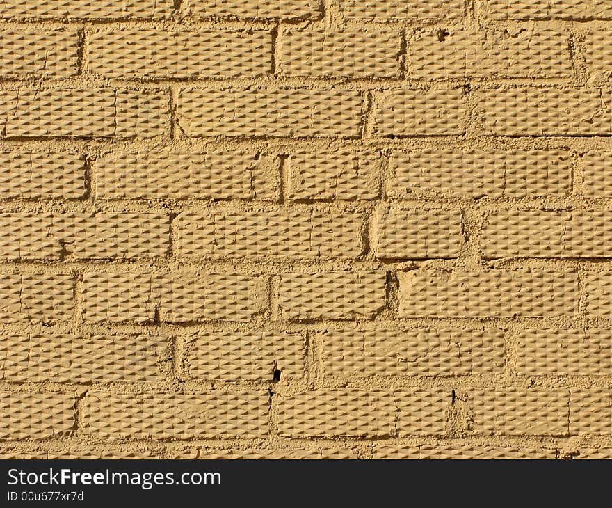 Beige colored rough brick wall texture. Beige colored rough brick wall texture