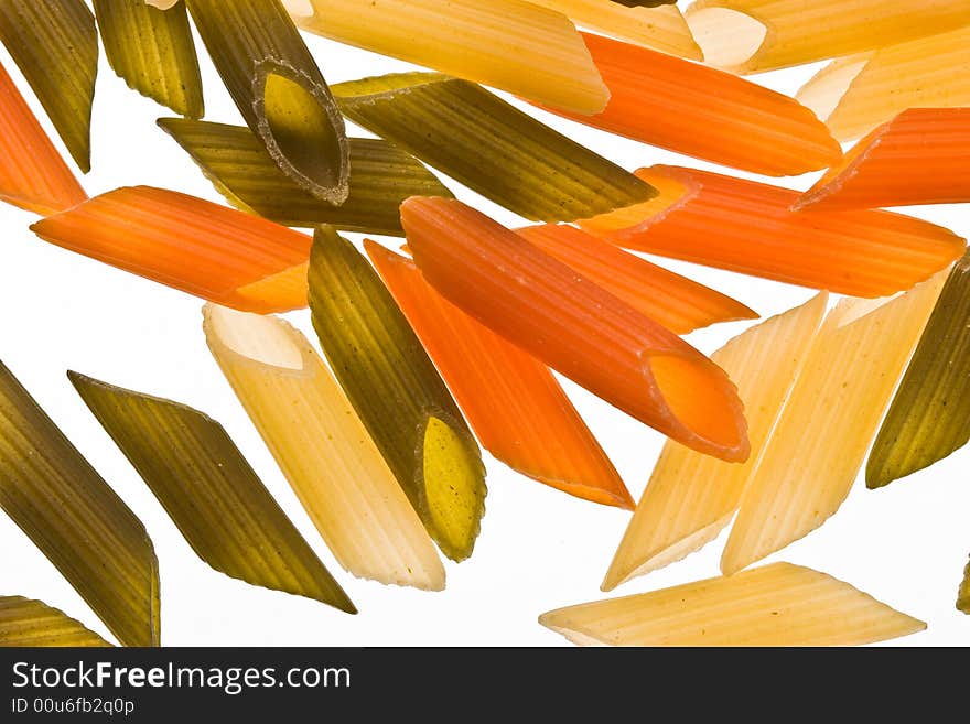 Assorted colours pasta over white background, colored macaroni