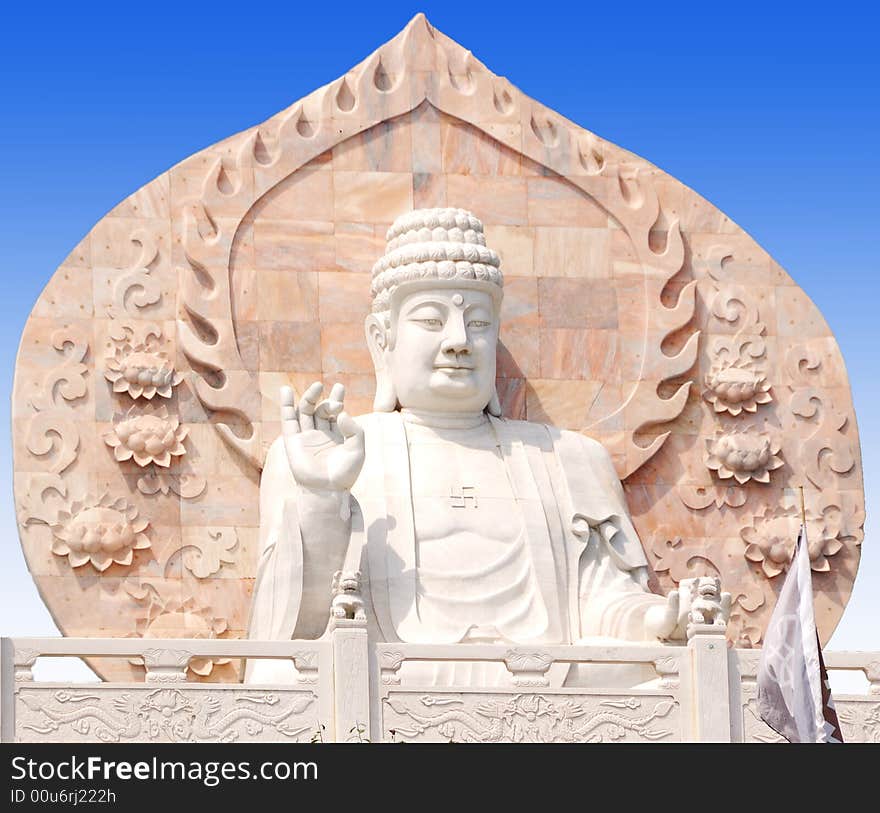 Marble Buddhist statue sitting in Rongcheng City, Shandong Province China. Marble Buddhist statue sitting in Rongcheng City, Shandong Province China