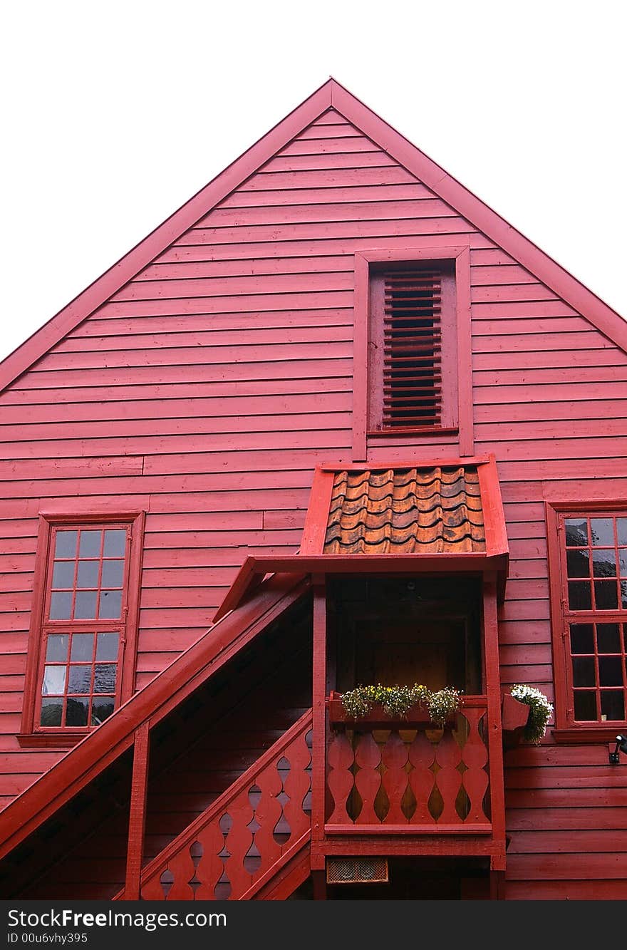 Detail of a front part of a red wooden house, Bergen, Norway. Detail of a front part of a red wooden house, Bergen, Norway