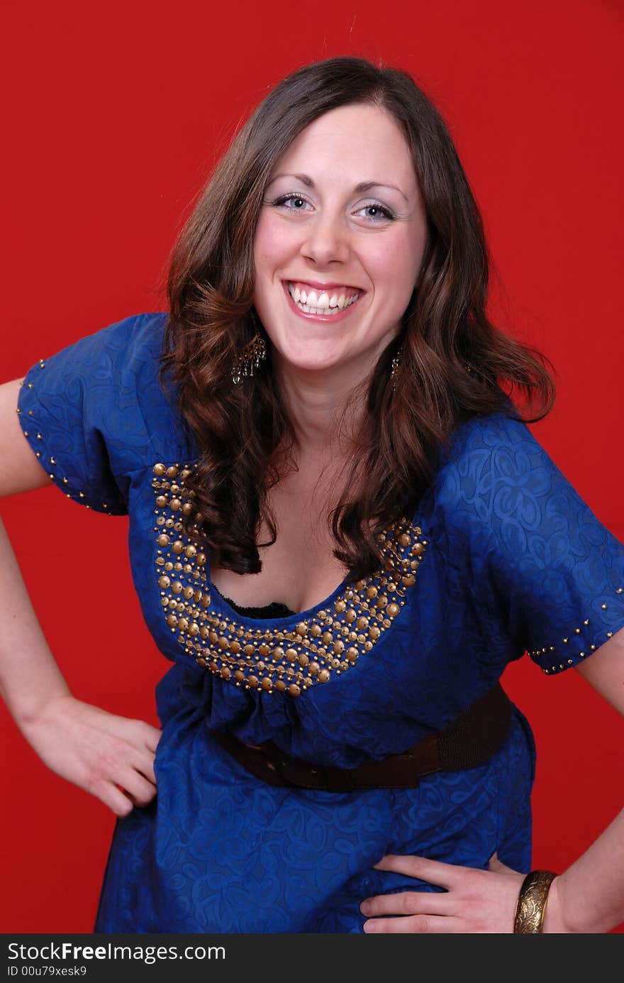 Portrait of attractive young lady with big smile, on red background. Portrait of attractive young lady with big smile, on red background