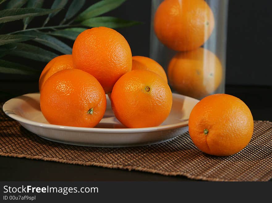 Wholesome oranges in a natural setting. Wholesome oranges in a natural setting.