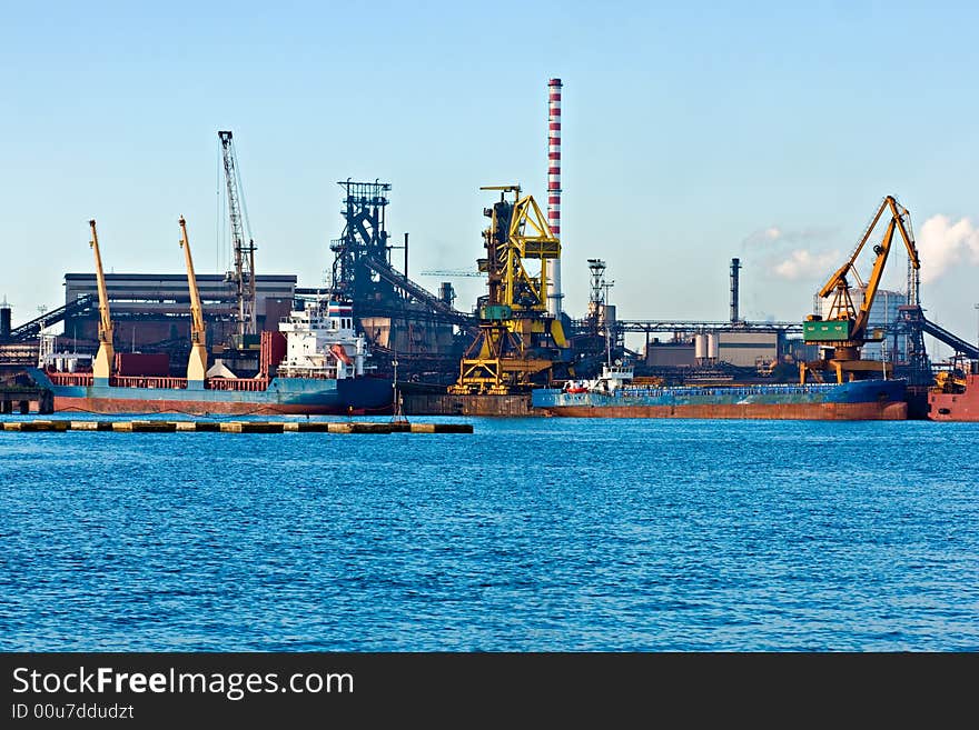 Crane  in Piombino harbor, Tuscany, Italy. Crane  in Piombino harbor, Tuscany, Italy.