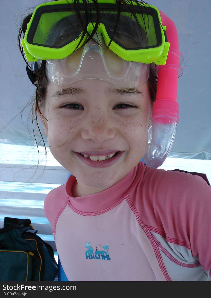 Girl with Snorkel and Mask getting ready to get in the water