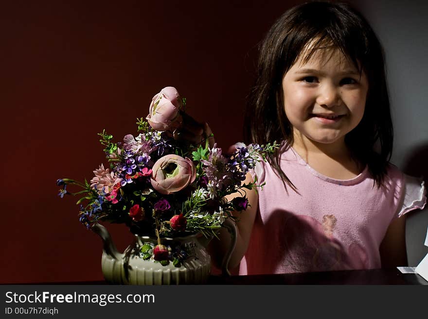 Girl next to flowers