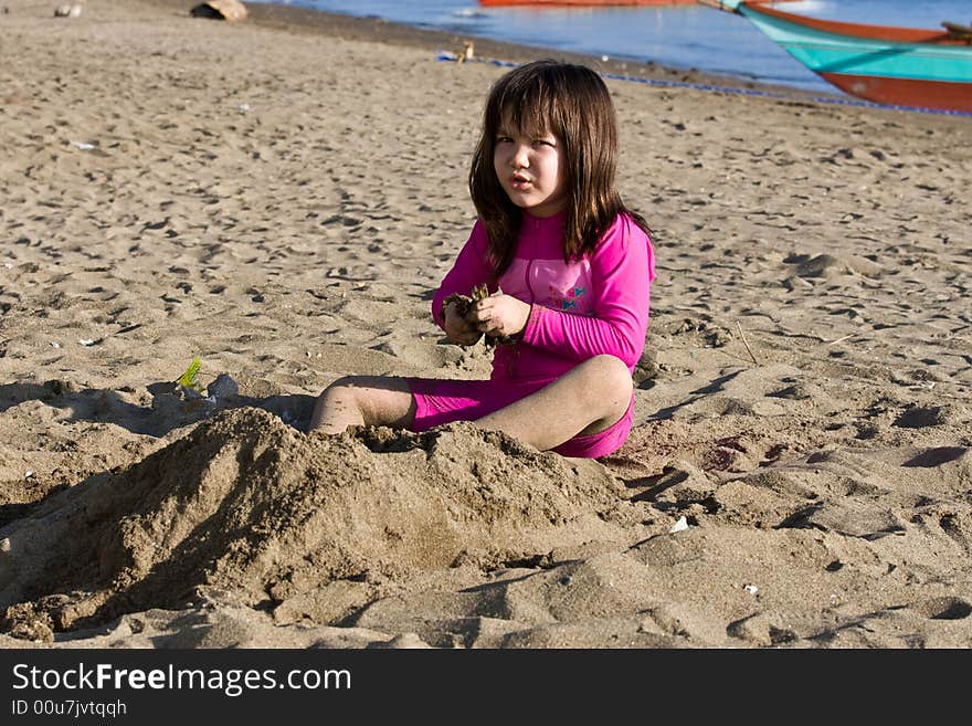 Girl playing with sand