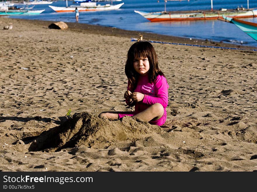 Girl playing with sand