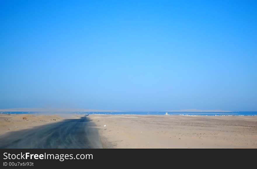 Road on the desert to the sea. Road on the desert to the sea.