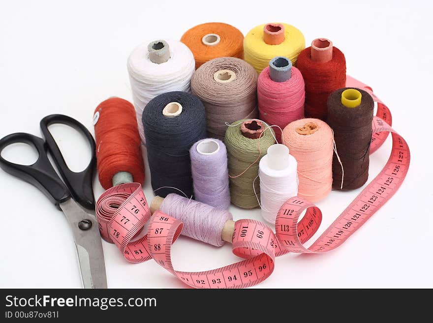 Set of a color thread, scissors and tape measure. Set of a color thread, scissors and tape measure