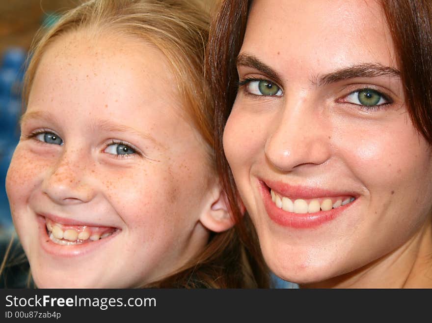 a beautiful white caucasian child with her mother showing love. a beautiful white caucasian child with her mother showing love