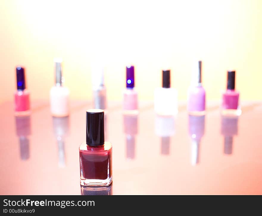 Group of different nail polishes on the sunshine background / copyspace. Group of different nail polishes on the sunshine background / copyspace