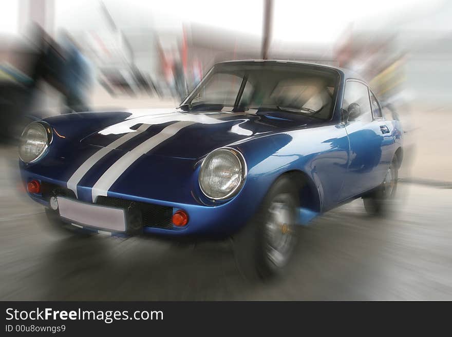 Artistic blur of a blue motor car. Artistic blur of a blue motor car.