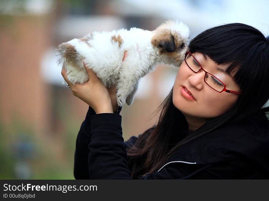 The baby kiss the young girl. The baby kiss the young girl