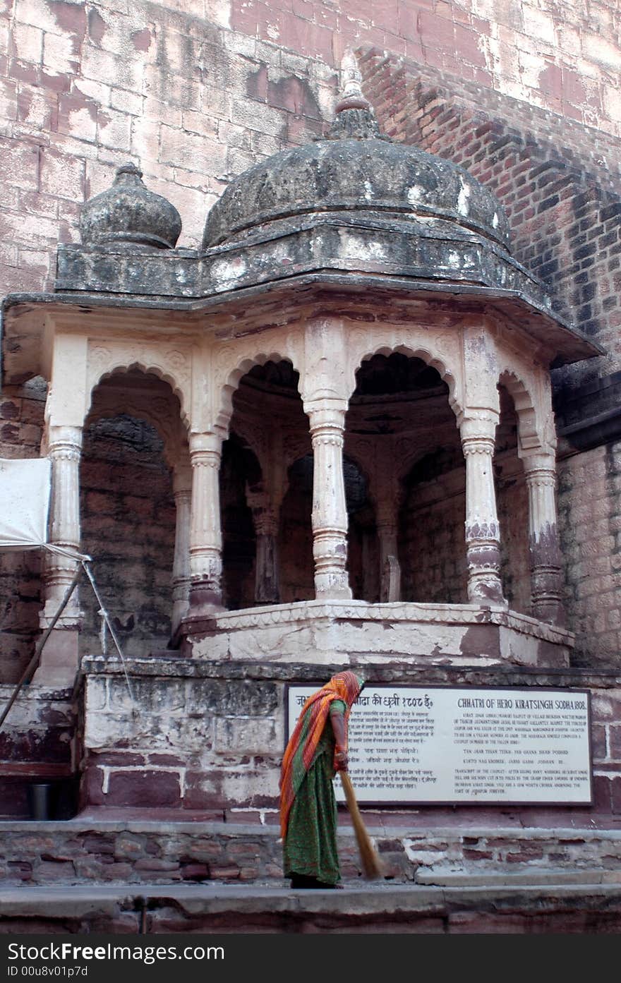 Woman sweeping near an old palace in Jodpur,India