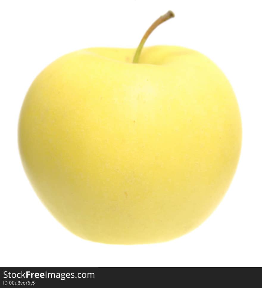 The yellow apple on white which is saved with path. Isolation, shallow DOF.