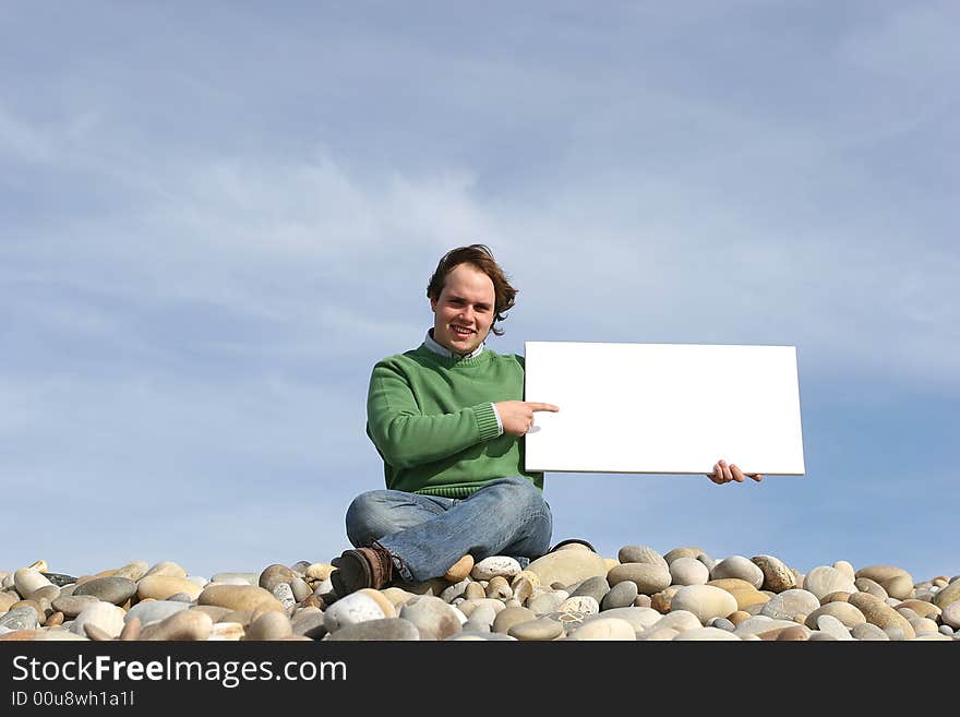 Young Man Holding White Card