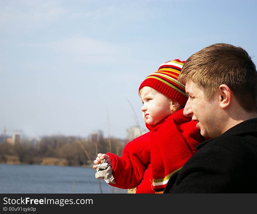 Daddy with his daughter looks at lake. Daddy with his daughter looks at lake