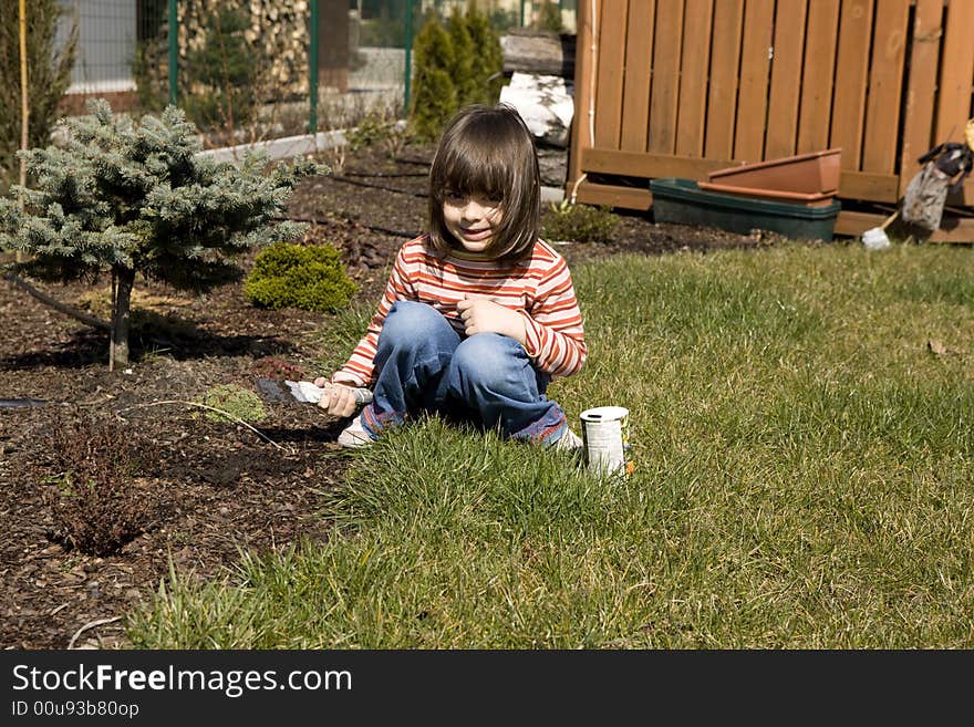 Young child gardener it plants