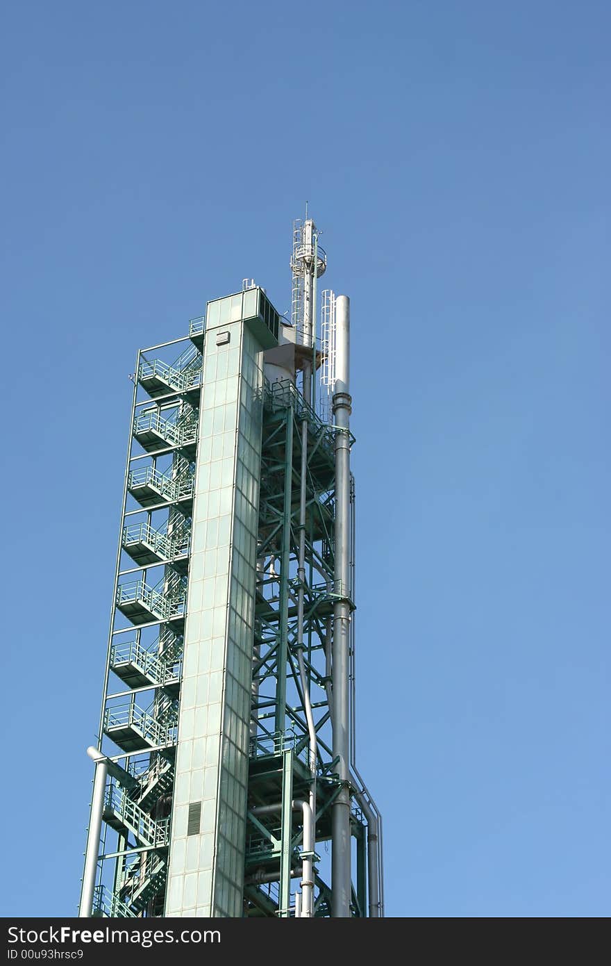 Chimney on a industrial building in blue sky. Chimney on a industrial building in blue sky