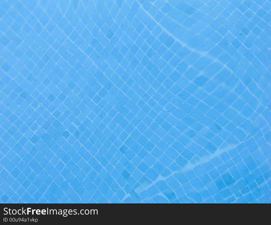 Abstract image of blue water in the swimming pool