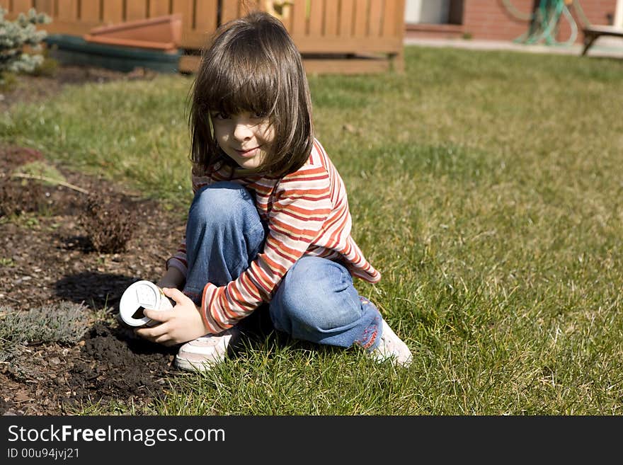 Young child gardener it plants