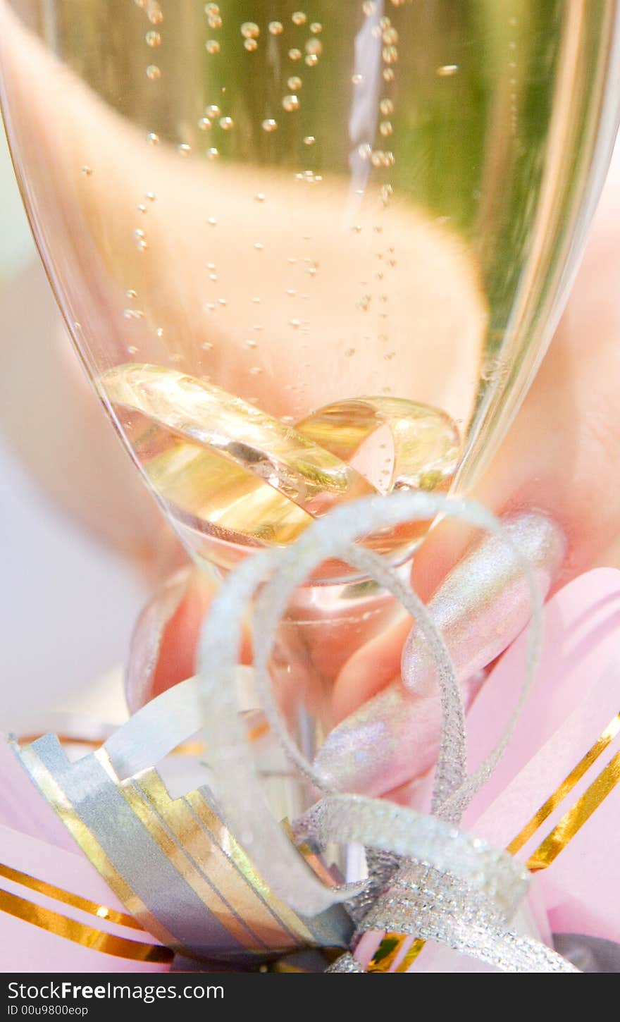 Two wedding ring in the glass of champagne. Two wedding ring in the glass of champagne