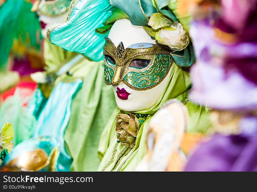 Green and gold costume in Venice