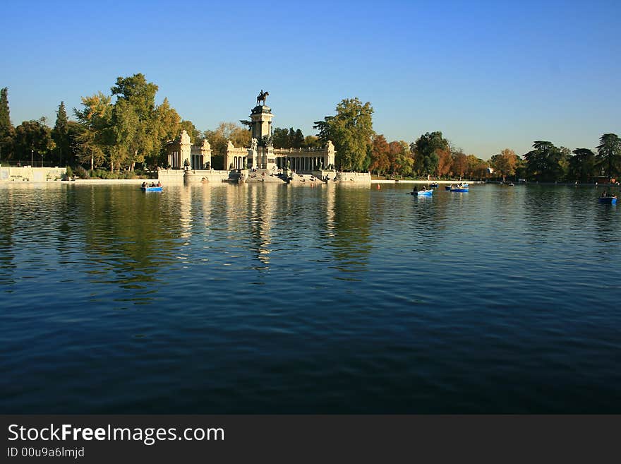 Central pond of Retiro gardens in Madrid, old royal gardens for public use since a century now, the monument is for king Alfonso XII. Central pond of Retiro gardens in Madrid, old royal gardens for public use since a century now, the monument is for king Alfonso XII