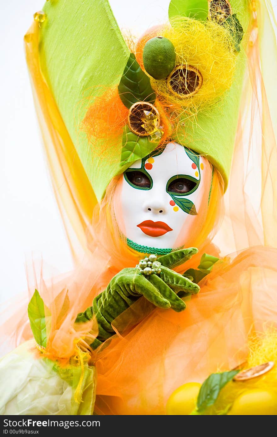 Colorful orange costume at the Venice Carnival. Colorful orange costume at the Venice Carnival