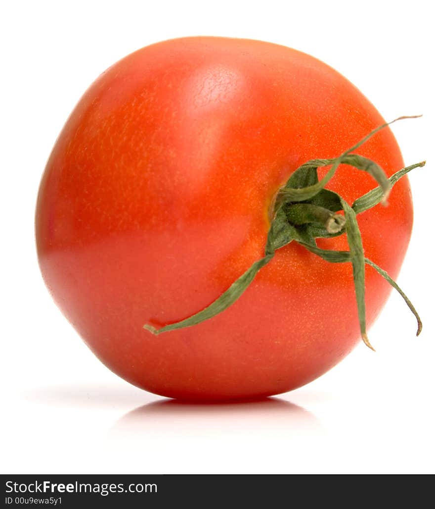 Perfect tomato on the white. Full isolation, shallow DOF.