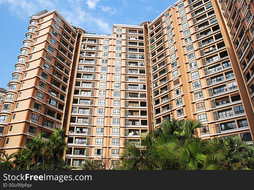 An apartment block under blue sky