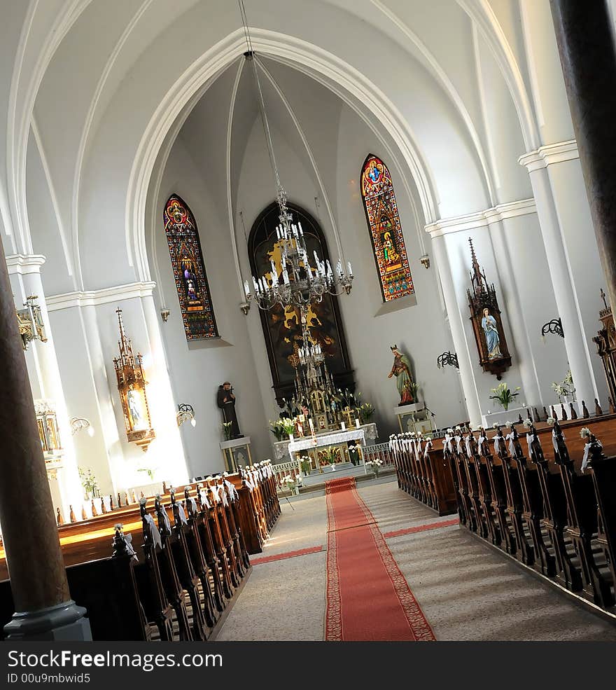 A view inside a beautiful catholic church. Dramatic angle