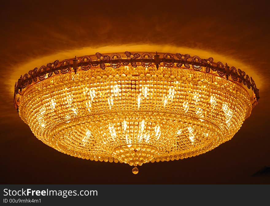 Multitude of small crystal lights of golden color. Multitude of small crystal lights of golden color.
