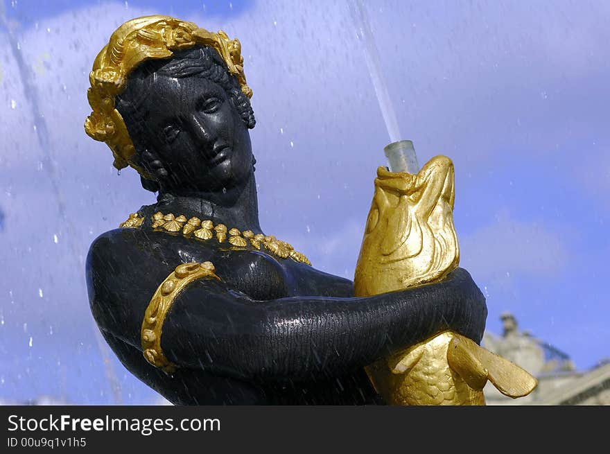 France; Paris;  detail of one of the fountain sculptures at the concorde square; place de la concorde bronze and gold leaf. France; Paris;  detail of one of the fountain sculptures at the concorde square; place de la concorde bronze and gold leaf