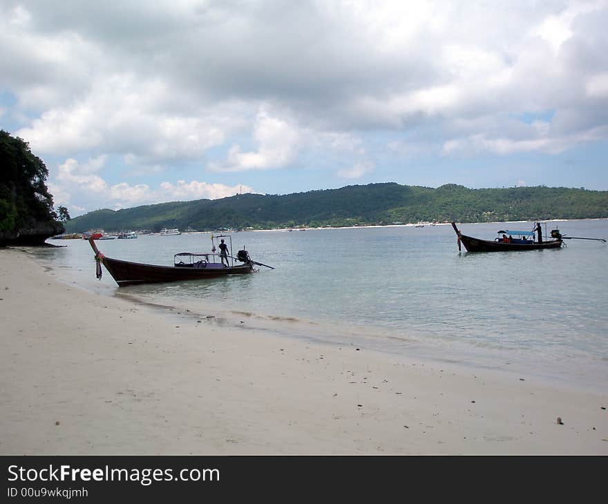 Longtail boats off Monkey Beach, Phi Phi Island, Thailand