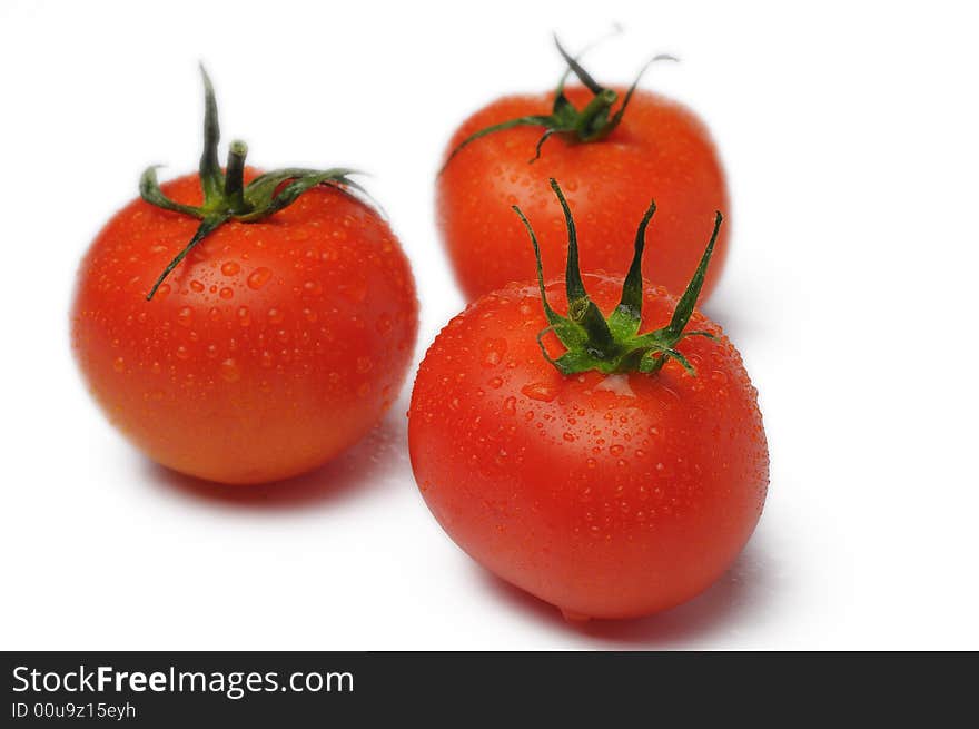 Fresh three tomato isolated on white background