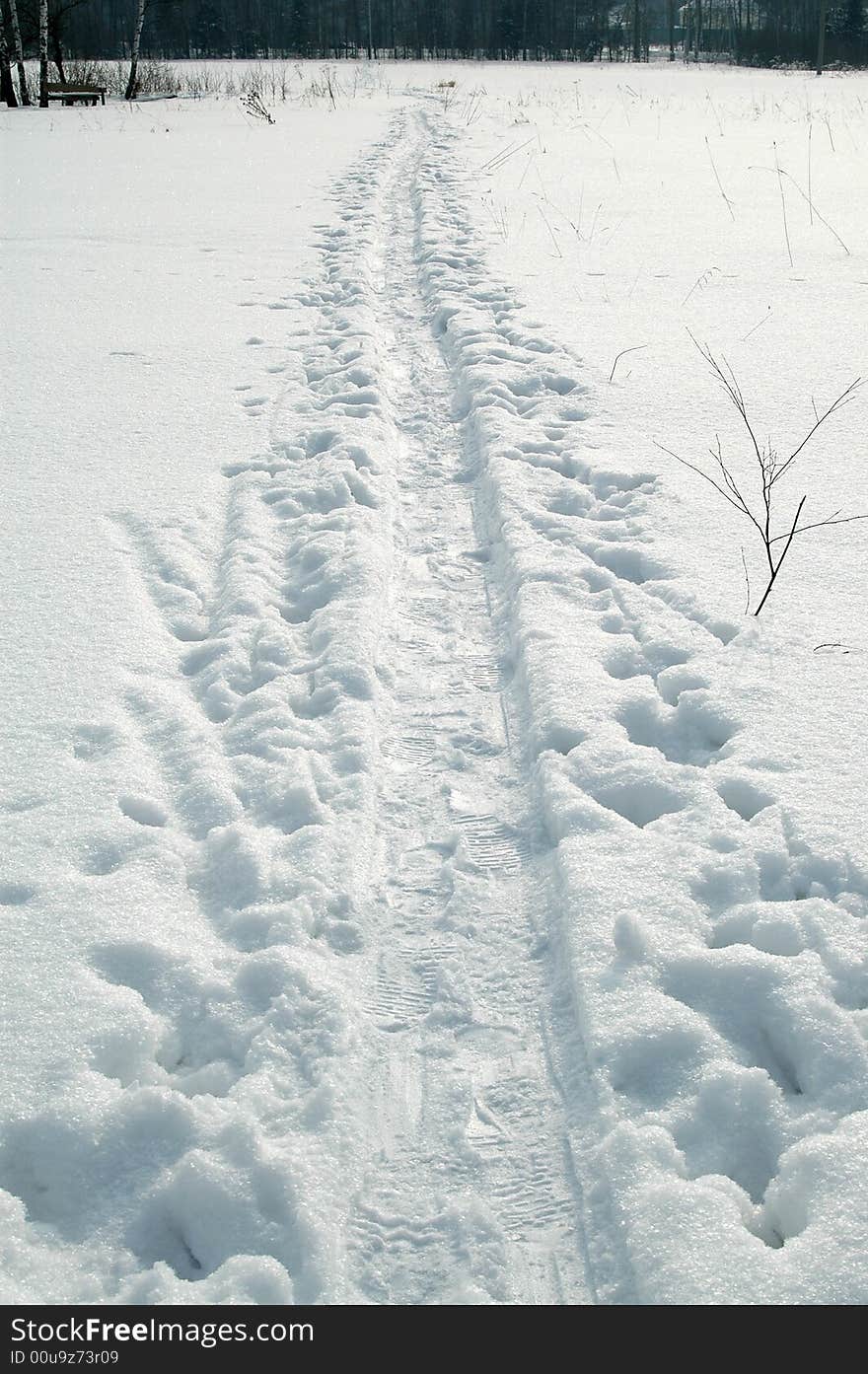 White winter snow road with tracks, Russia