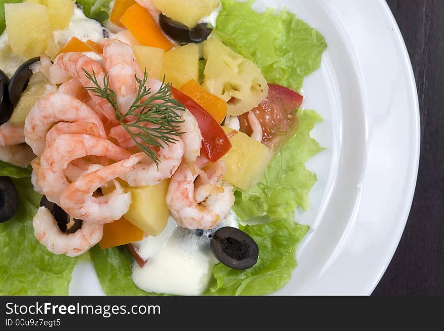 Prawn salad. Simple and healthy salad of shrimp, mixed greens, red pepper and olive.