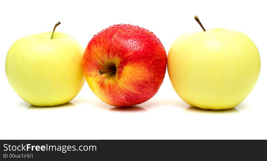 Red and yellow apples with water drops on the white background. Isolated.