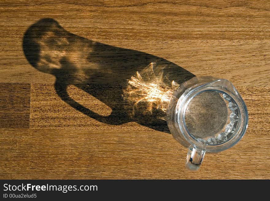 Decanter with water on a wooden floor. Decanter with water on a wooden floor.