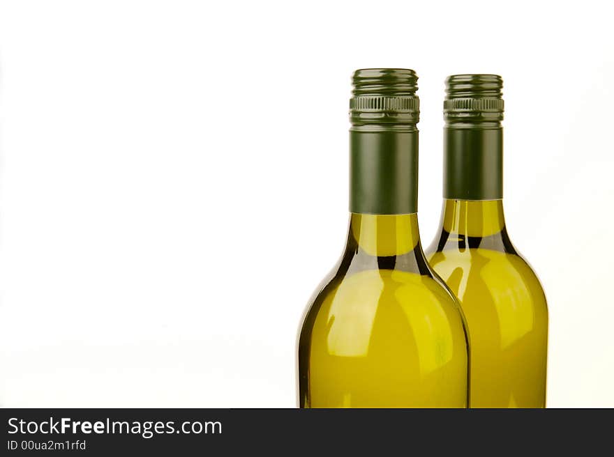 White wine bottles isolated against a white background